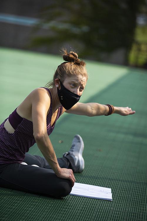 Piper Morgan Hayes stretches on the tennis courts.