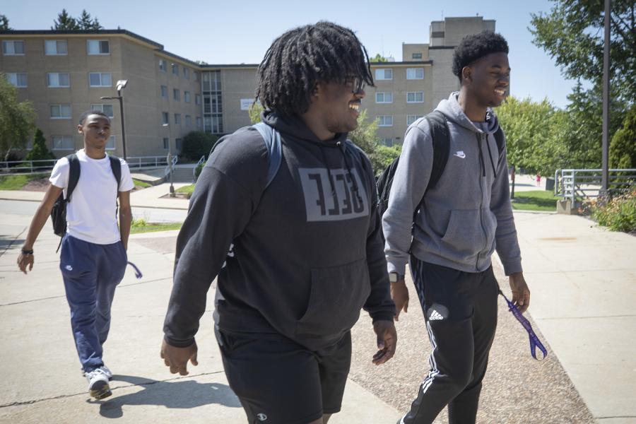 Students walk through campus.