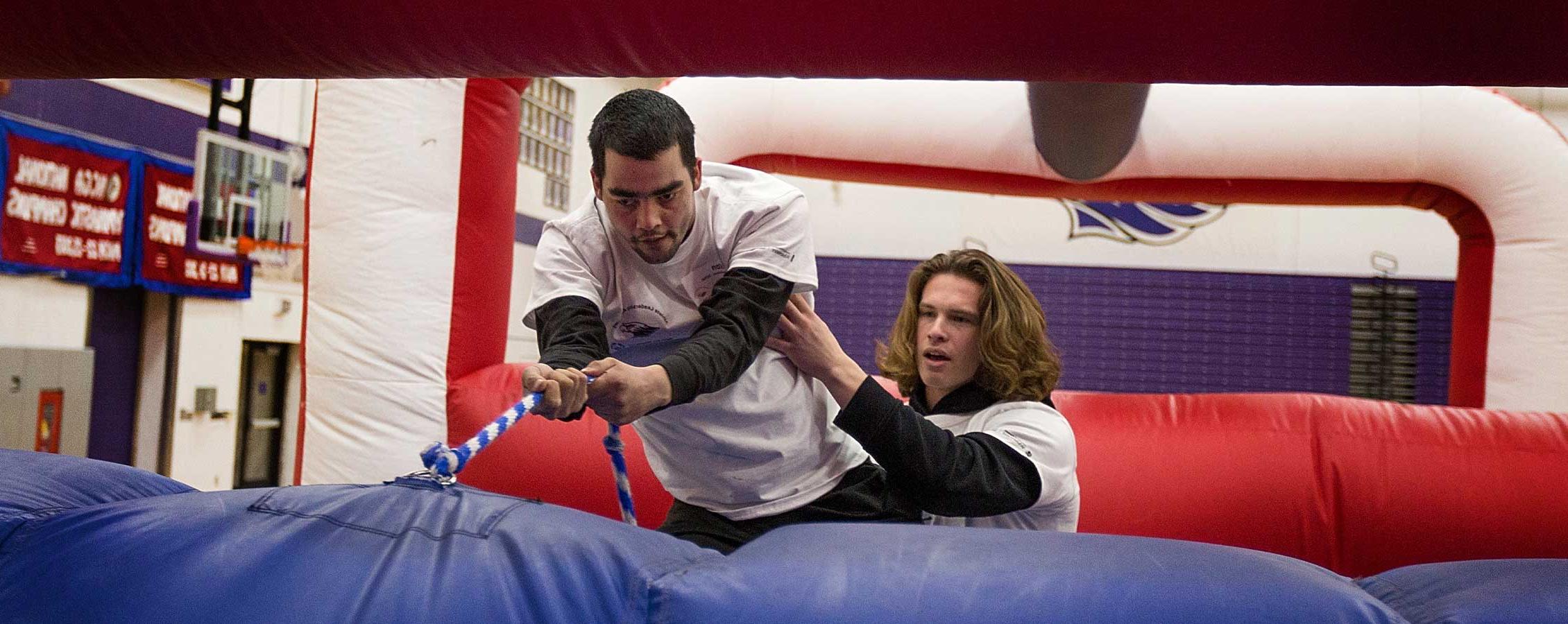 Students on a jump house